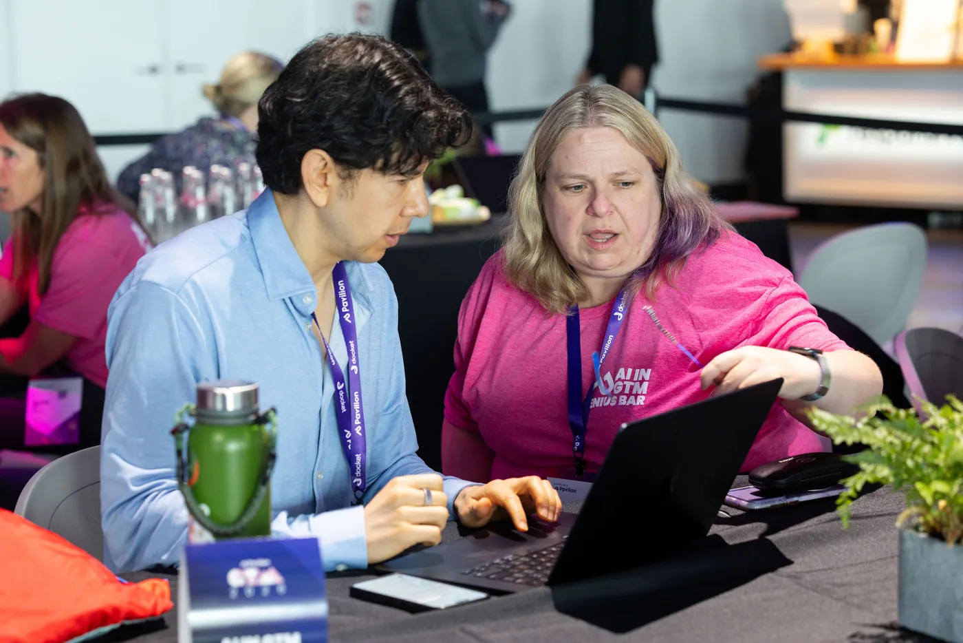 Crys Black working one on one with an attendee on a laptop at the AI in GTM Genius Bar, Pavilion GTM2026